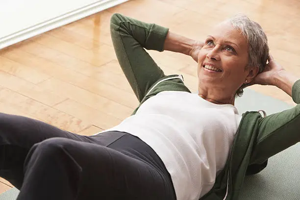 Photo of Woman doing sit-ups