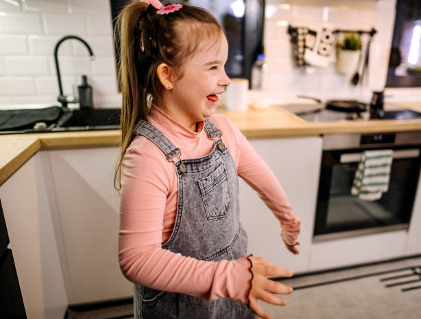istock Happy little girl in the kitchen 1379262819