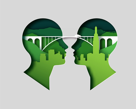 Papercut craft illustration concept of two people heads united by paper cut bridge and car travelling on nature mountain landscape with city skyline. Idea communication or relationship travel concept.
