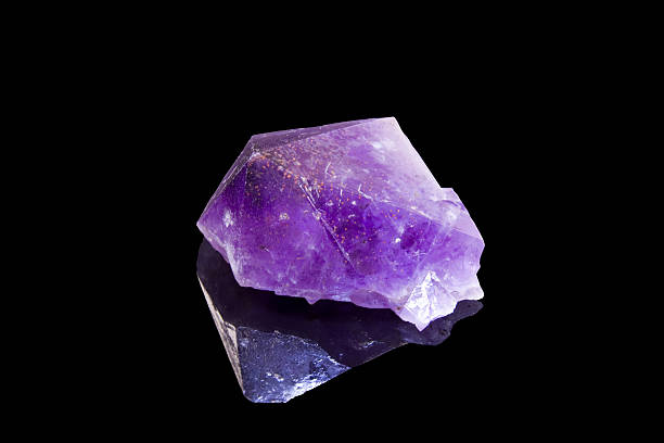 amethyst crystal over black background amethyst crystal with reflection over a black background la geode stock pictures, royalty-free photos & images