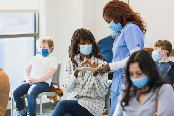 istock Woman explains medical information 1379306234