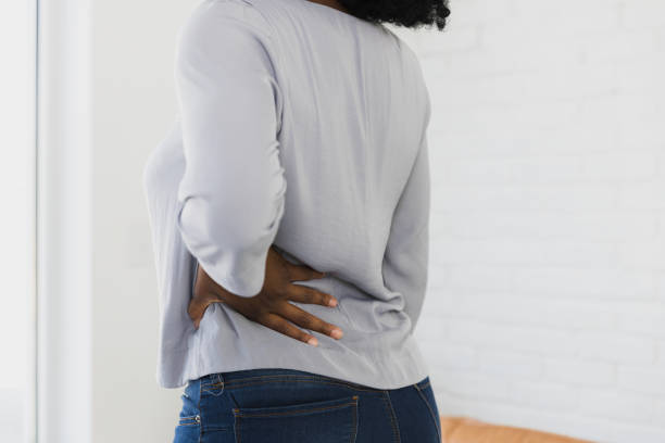 istock Unrecognizable woman has severe lower back pain 1379309406