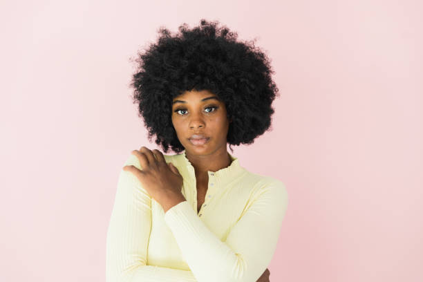 istock Serious, young woman looks at camera 1379309422