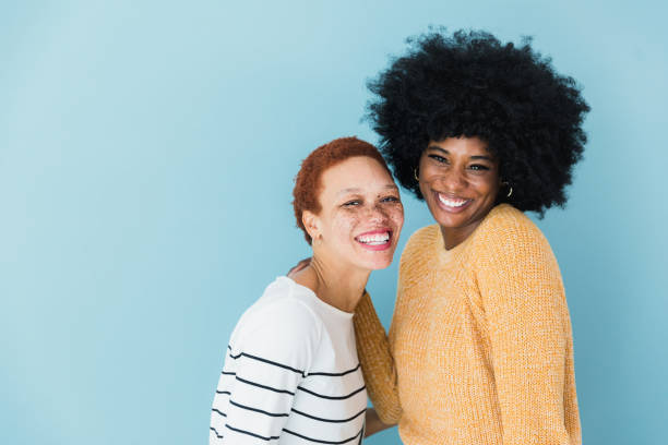 istock Two women with big beautiful smiles look at camera 1379309446