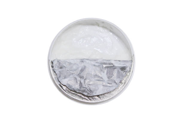 istock Opened plastic jar of cream. Face and body cream. Top view. Selective focus. The isolated object on a white background. Isolate. 1379311009