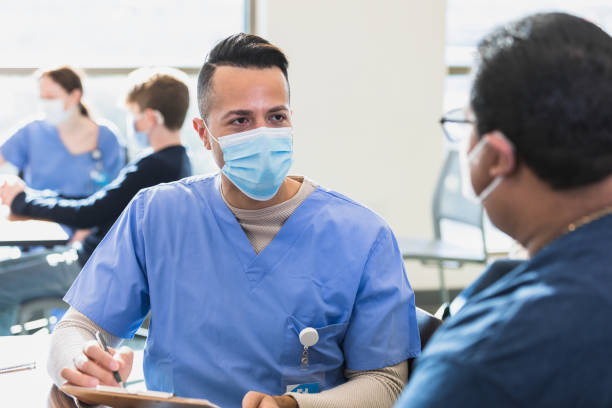 istock Doctor listens to the patient 1379312659