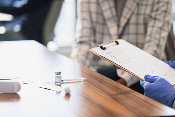 istock Doctor prepares to inject vaccine 1379313175
