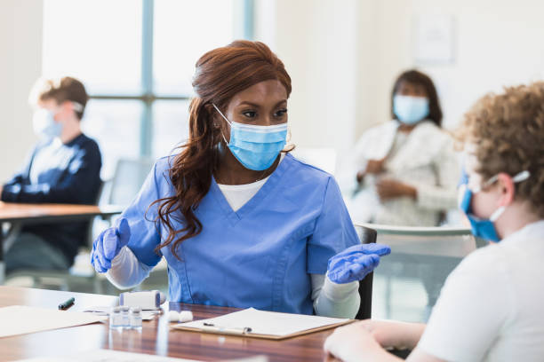 istock Nurse talks to the patient 1379313184