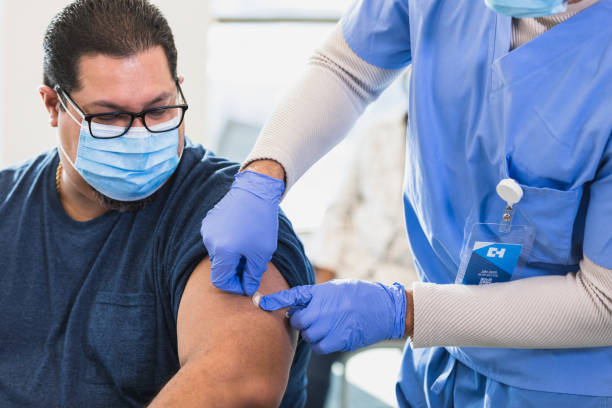istock Doctor applies bandage 1379313232
