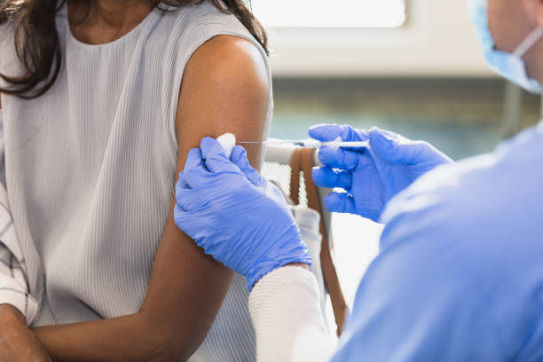 istock Doctor administers vaccine 1379313235
