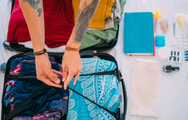 istock Man packing his suitcase  for a trip home 1379313770