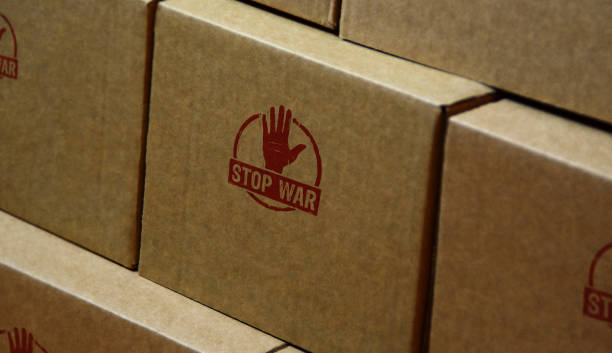 istock Stop war stamp and stamping hand. 1379327326