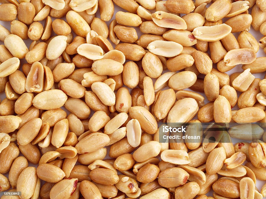 Fried peeled peanuts. Close up of fried, peeled and salted peanuts.  Appetizer Stock Photo