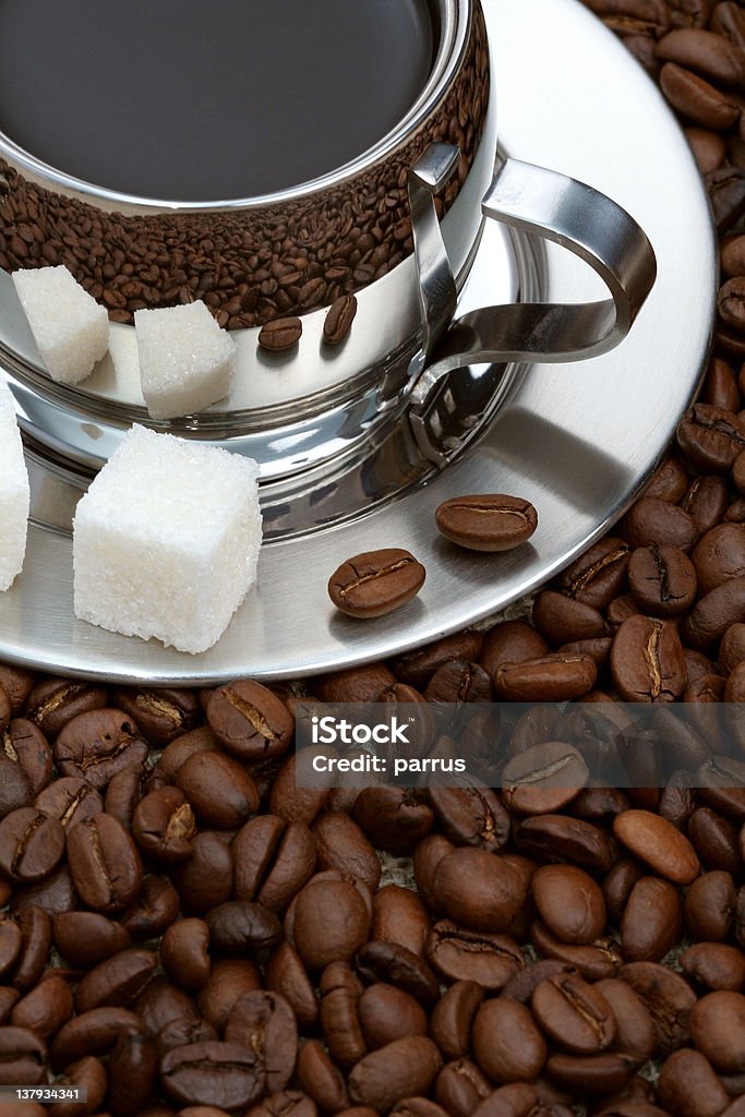 Cup of coffee with lump sugar and beans Cup of coffee with lump sugar and beans, coffee series Arabica Coffee - Drink Stock Photo