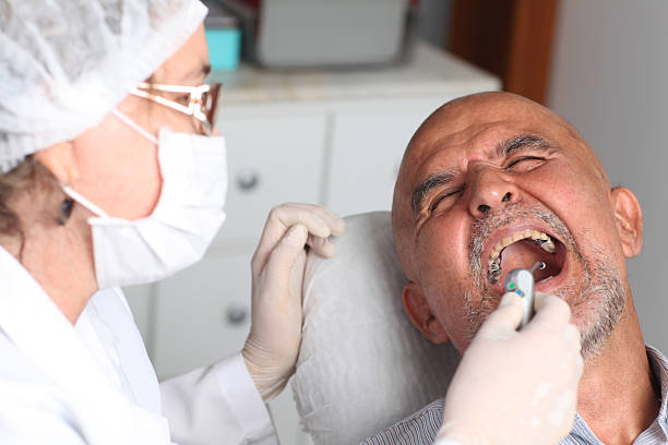 istock Older man with toothache at the dentist 137935622