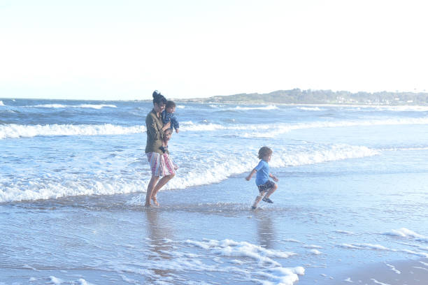 istock family playing in the sea 1379375492