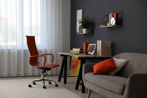 istock Modern workplace with comfortable chair in stylish home office interior 1379377612