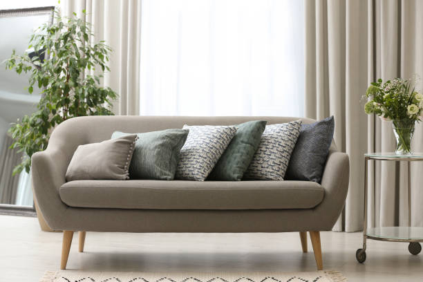 istock Sofa with pillows in modern living room interior 1379379182