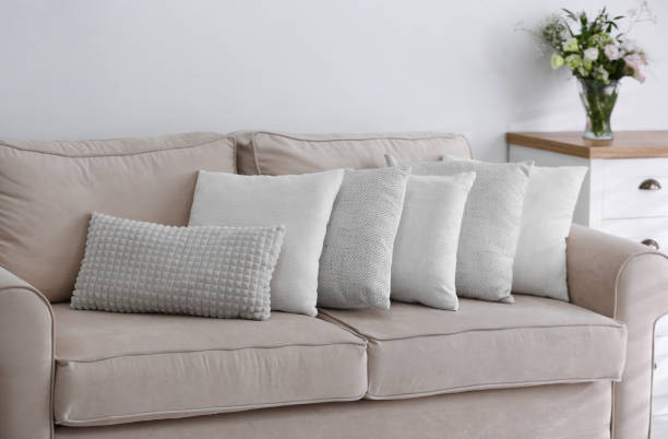 istock Sofa with pillows in modern living room interior 1379380842