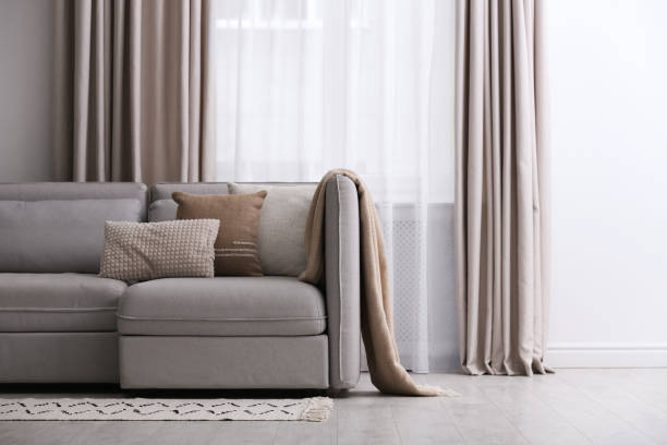 istock Modern living room interior with beautiful curtains on window 1379386915