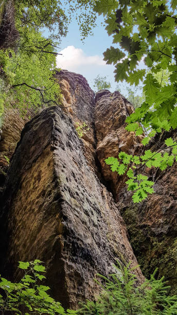 istock Three naturally framed sandstone rocks in a forest, Saxony, Germany 1379390403