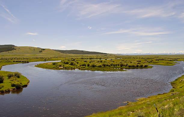 istock Big Hole River with snowcapped mountains, MT 137940521