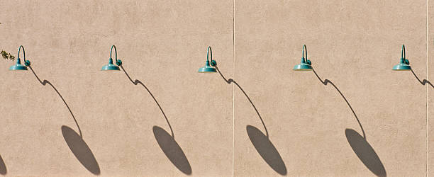istock Green Lamps and Shadows on Brown Stucco Wall 137940669