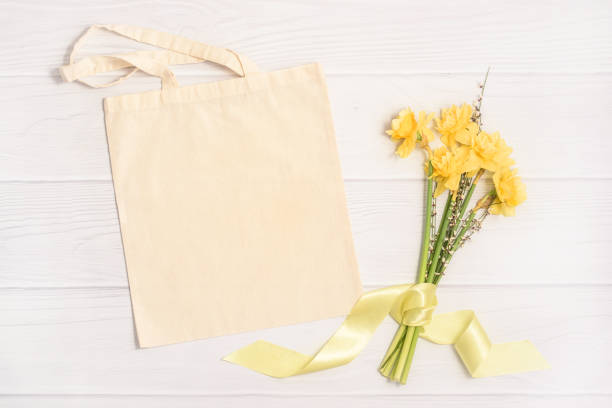 istock Easter mockup with white tote bag and yellow bouquet 1379409338