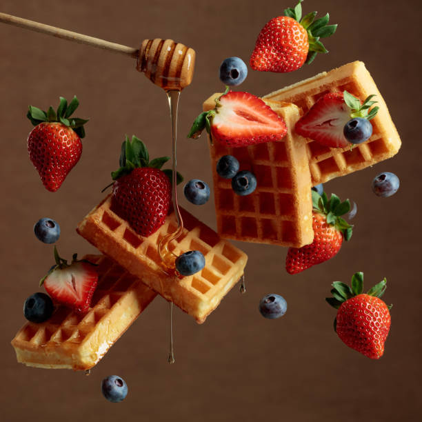 istock Waffles with blueberries, strawberries, and honey. 1379412525
