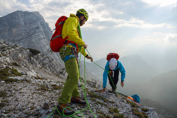 istock Group of mountain climbers on their way to the top 1379412599