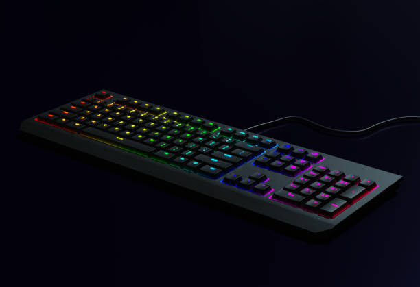 Rainbow keyboard. Black Gaming keyboard with RGB light. Backlit keyboard in a dark room, 3d render.