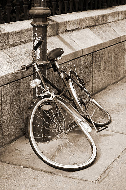 istock Damaged bicycle locked to an iron pillar 137941889
