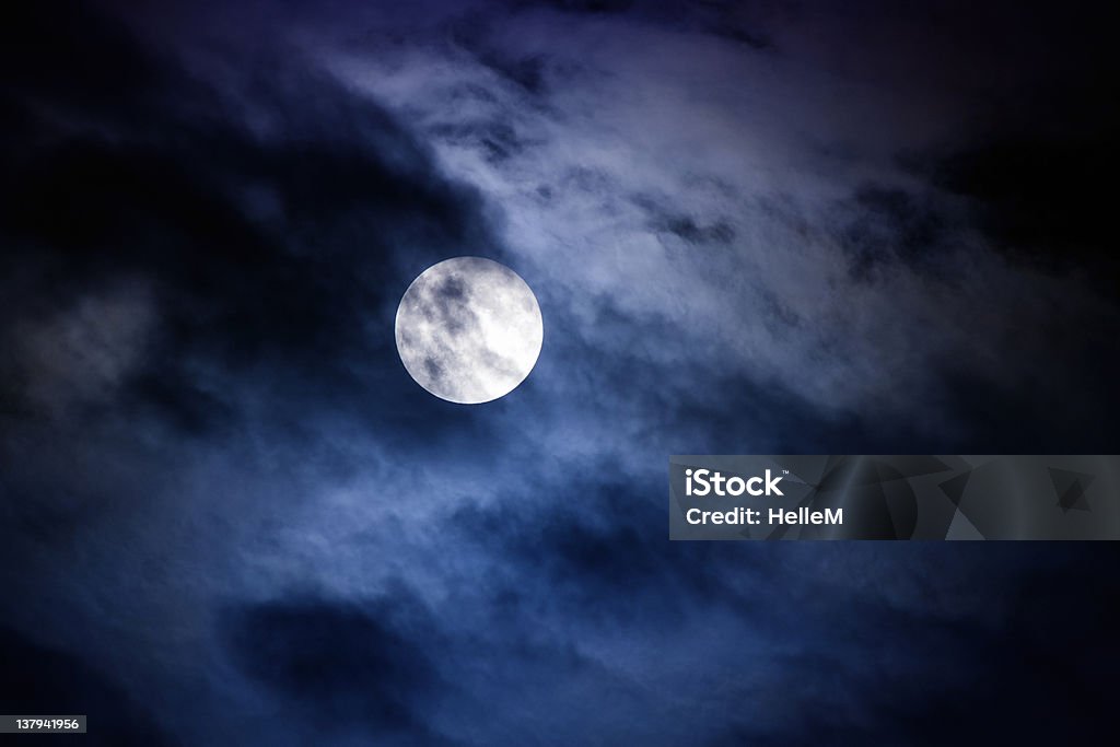 Moon - Midnight Moon at midnight with clouds covering the moon slightly Black Color Stock Photo