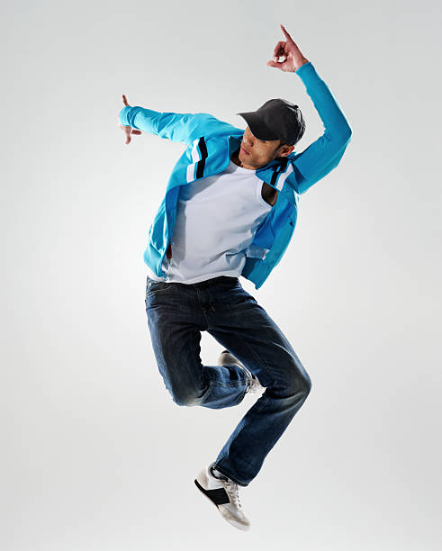 istock Man in blue jacket dancing and jumping in the air 137942931
