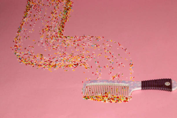 comb comb colorful crumbs and drag them behind on a pink background creative concept - cake pick imagens e fotografias de stock