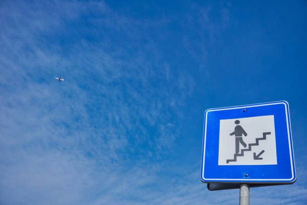 istock underpass sign for pedestrians, blue sky and copy space 1379476049