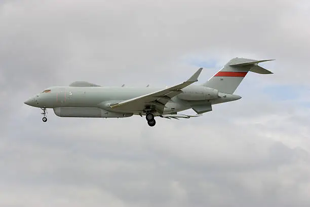 An electronic warfare aircraft about to land at a military airbase.