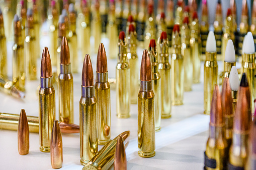 Bullets - different types of ammunition for small arms on display at gun shop