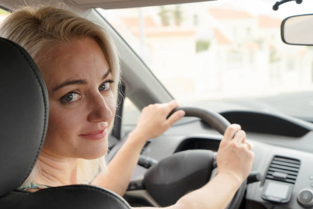 istock Woman driving car 1379509865