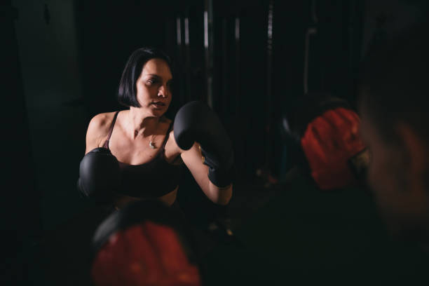 istock Woman training boxing in gym 1379540955