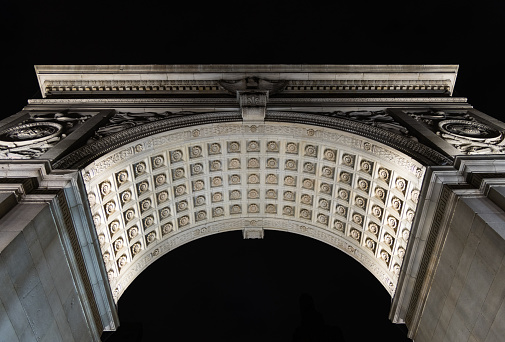 Detail of the Washington Square Arch at night in winter, Manhattan, New York