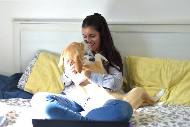 istock young woman hugging her dog 1379579389