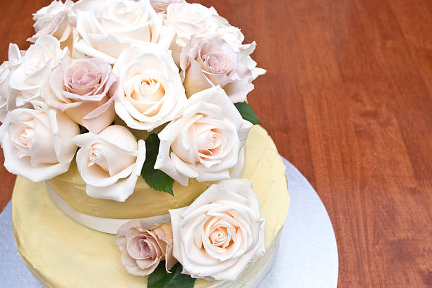 istock Cream and latte roses on a beautiful cake 137958577