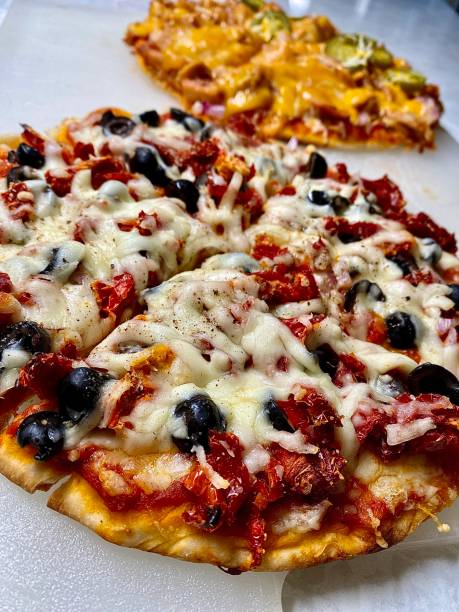 istock Two Loaded Homemade Pizzas 1379596119