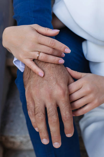 istock the bride and groom hold hands. 1379598209