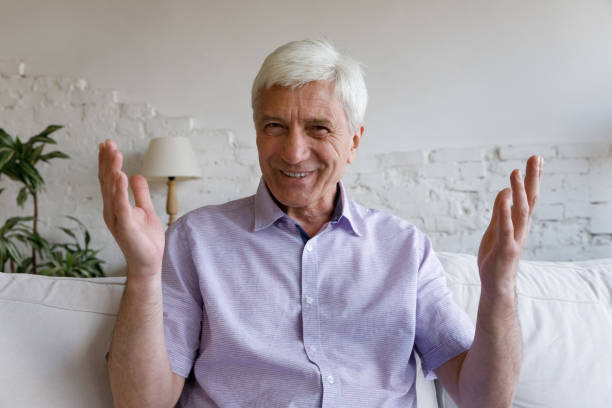 istock Happy man talking and smiling at camera 1379620869