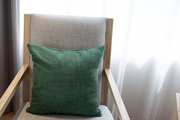 istock Green pillows in  chair,  Curtains background 1379644719