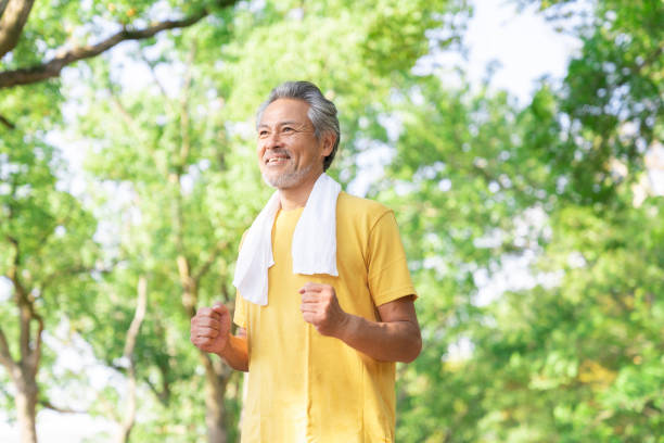 istock elderly man exercising in the park 1379658987