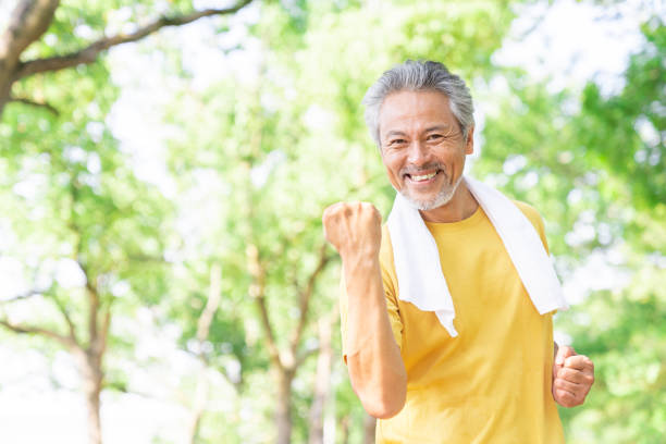 istock elderly man exercising in the park 1379659010