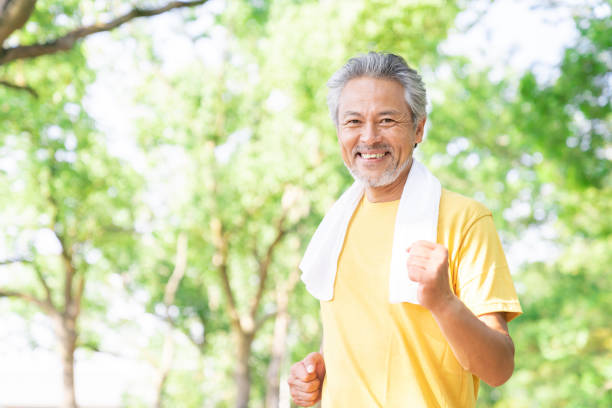 Asian elderly man exercising in the park